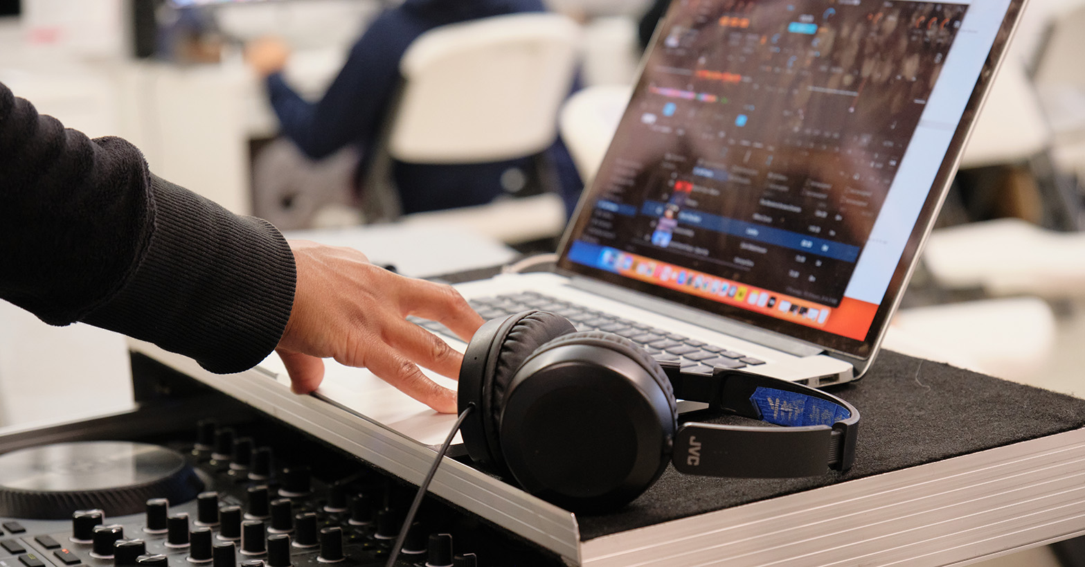 Image of a hand mixing sound on a computer