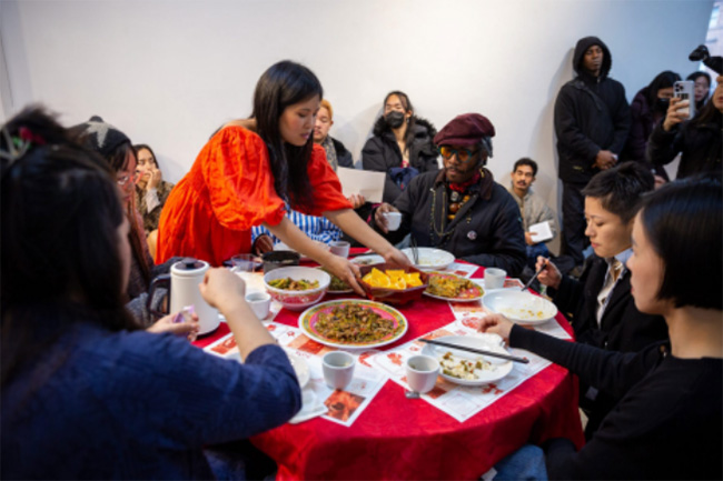 image of Lena Chen serving food to a group of women