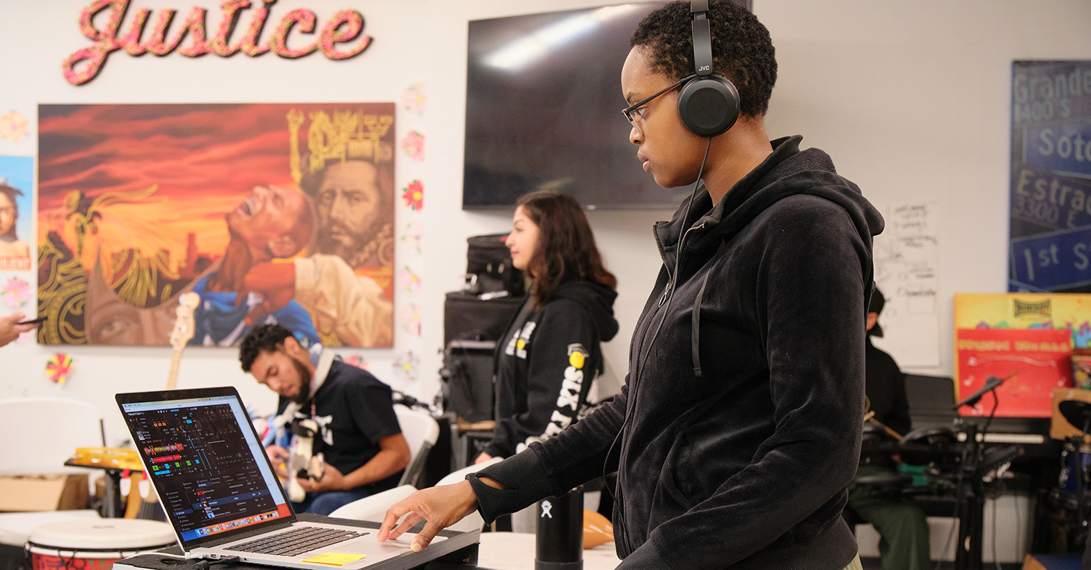 YOung black woman mixing sound