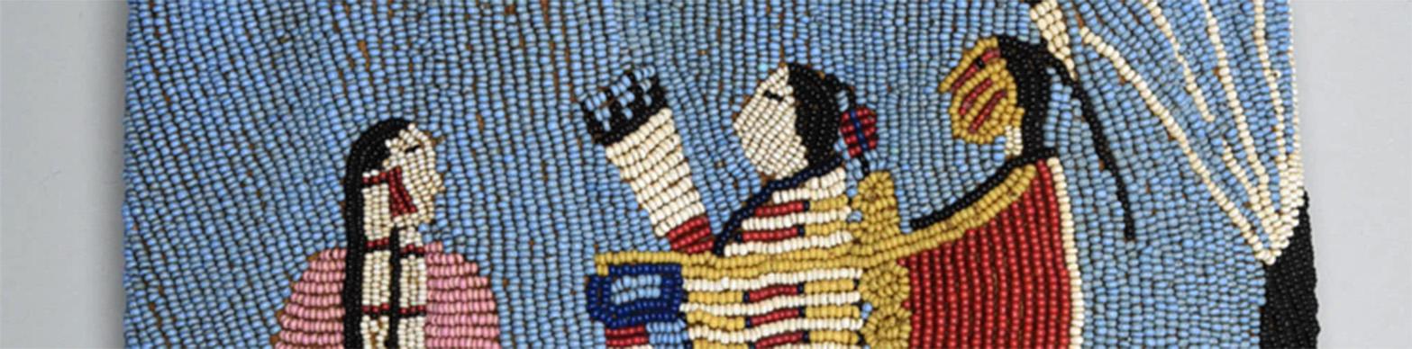 traditional native american beadwork depicting a woman and two men in traditional attire