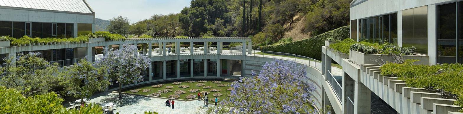Image of contemporary museum courtyard nestled against a California hill